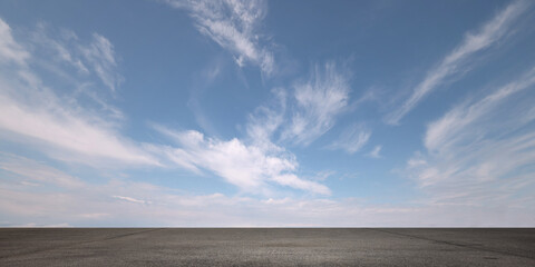 Heavenly Blue Sky Background with Beautiful Nice Weather Clouds and Empty Gray Asphalt Floor - 560462552