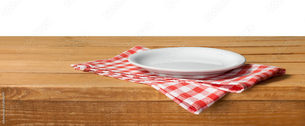 Poster Empty wooden table with color tablecloth and plate