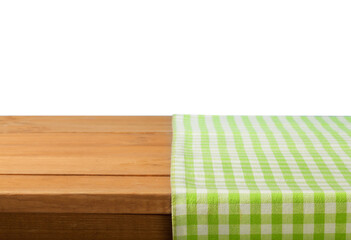 The empty wooden table covered with a color Picnic tablecloth.
