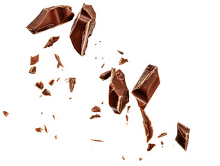  Levitating milk chocolate chunks isolated on white background. Flying Chocolate pieces, shavings and cocoa crumbs Top view. Flat lay. - obrazy, fototapety, plakaty