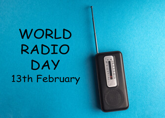 World Radio Day 13 February text with radio on blue background. Selective focus
