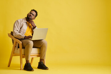 Studio portrait of entrepreneur pondering over ideas for new project