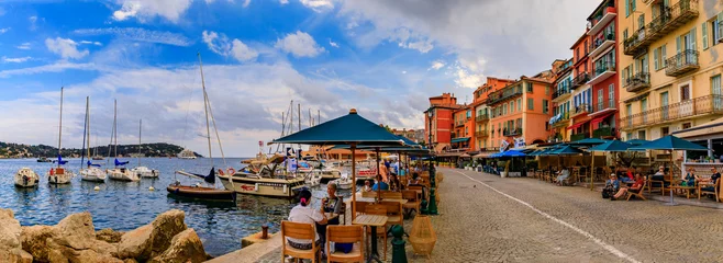 Papier Peint photo autocollant Nice Seaside promenade with colorful traditional houses along the Mediterranean Sea in Villefranche sur Mer Old Town on the French Riviera, South of France