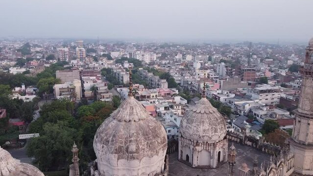Aerial drone shot of old mosque in between the city of lucknow 