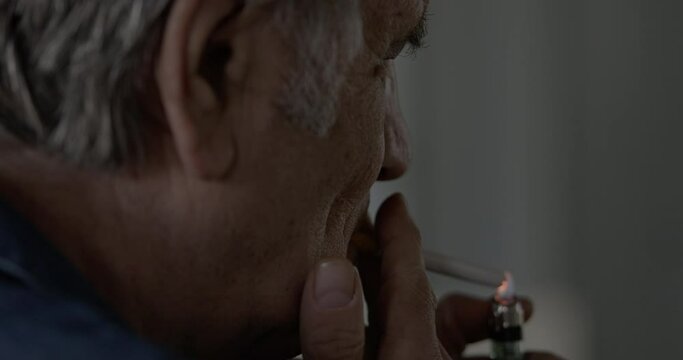 Old man smoking a cigarette