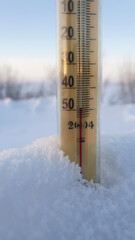 Thermometer on a winter morning in a severe frost