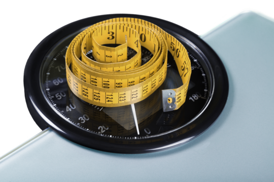 A Measuring Tape on a Weight Scale