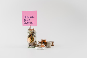 Dentist Medical Bills savings budget fund jar concept isolated on a white background