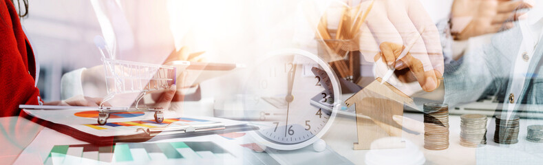 Businessman and team analyzing financial statement Finance task. with smart phone and laptop and...