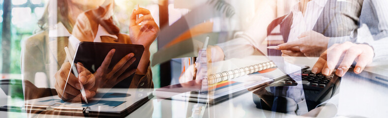 Businessman and team analyzing financial statement Finance task. with smart phone and laptop and...