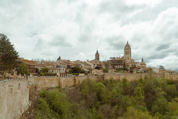 Fototapeta na wymiar Segovia, España. April 28, 2022: Landscape of the city walls and cathedral of Segovia.
