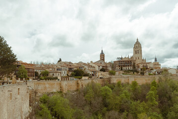 Fototapeta na wymiar Segovia, España. April 28, 2022: Landscape of the city walls and cathedral of Segovia.