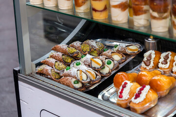 Neapolitan bakers preparing famous Italian pastries in a traditional bakery in Naples, Italy