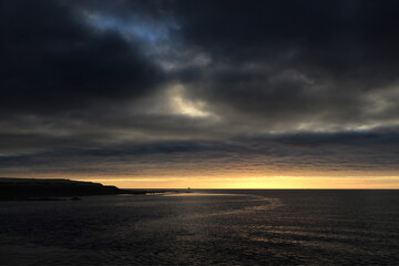 Obraz premium Fjord in Iceland with cooled volcanic lava rock at night,
