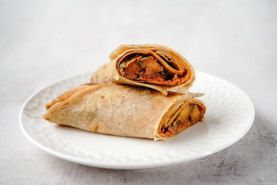 Potato Kathi roll - Indian vegetarian wrap with roti, selective focus