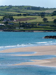 Inchydoney beach at low tide on a sunny day. The famous Irish beach on the south coast of the country. Seaside landscape.