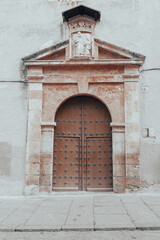 Segovia, España. April 28, 2022: Doors of houses in the city. Wooden doors.
