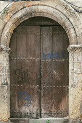 Segovia, España. April 28, 2022: Doors of houses in the city. Wooden doors.