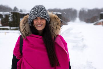 Fototapeta na wymiar Swedish girl in Drottningholm park, Sweden. Caucasian tourist woman visiting Queen's royal residence in Stockholm, famous attraction in Sweden. Winter holiday concept.