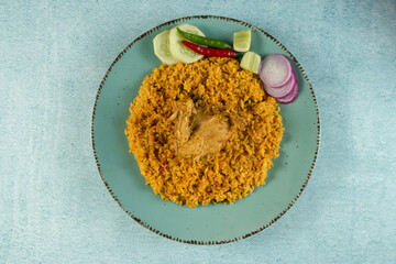 spicy chicken pulao, polao, biryani, mandi, kacchi with salad served in dish isolated on table top view of indian food
