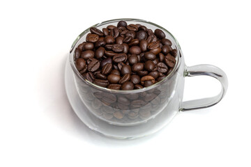 Glass cup with coffee beans isolated on white background.