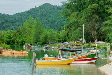 Obraz premium Fishing boats by the riverside in Kijal, Kemaman, Terengganu, Malaysia.