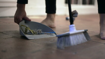 Person with brush and dustpan sweeping floor at home. housework, cleaning and housekeeping concept2