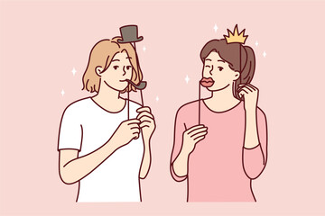 Girl friends with funny masks for photo shoot during house party or holiday carnival. Young casual women put cardboard lips and smoking pipe or crown with hat on their face. Flat vector illustration 
