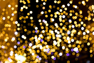 Fototapeta na wymiar Festive Christmas night city defocused warm yellow bokeh lights abstract background