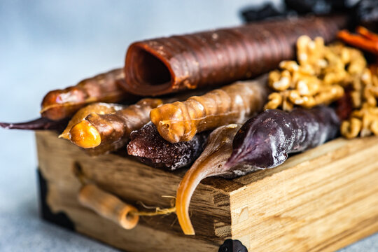 Traditional Georgian churchkhela, tklapi and gozinaki with assorted dried fruits and nuts