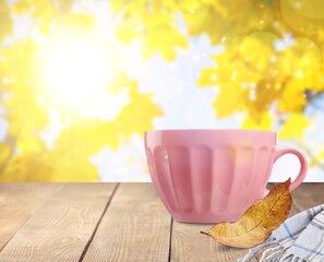 Cup of tasty sweet hot coffee on desk