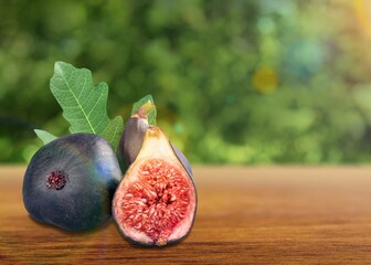Fresh juicy ripe sweet figs fruit on natural background