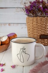 A cup with a warm warming drink on a wooden background