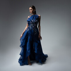 a model in an elegant evening dress dress