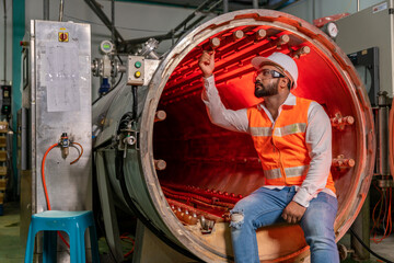 Team of engineers practicing maintenance Taking care and practicing maintenance of machines in the factory so that they can be used continuously.