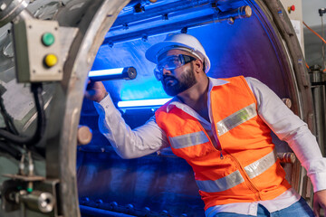 Team of engineers practicing maintenance Taking care and practicing maintenance of machines in the factory so that they can be used continuously.