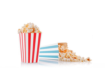 Glass with popcorn on a white background