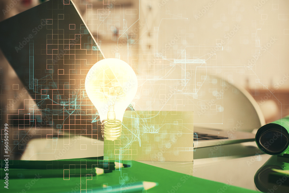 Poster Computer on desktop in office with bulb icon hologram. Multi exposure. Concept of idea.