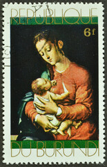 Cancelled postage stamp printed by Burundi, that shows painting Madonna and Child by L. de Morales, circa 1968.