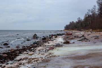 Seaside view at the Baltic sea with ice chunks in winter in January in Latvia