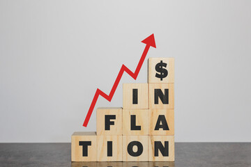 Inflation on wooden cubes with red arrow