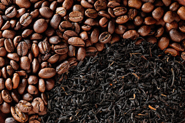coffee vs. tea. choice of drink concept. tea or coffee? coffee beans and natural black tea top view