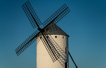 Isolated old windmill against blue sky