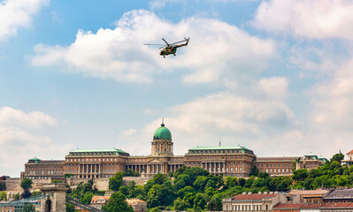 Helicopter flying over the Danube River and the Royal Palace