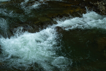 Bubbling mountain river. streams of water