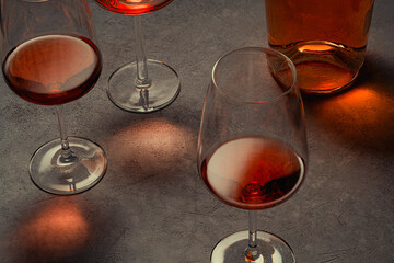 Glasses of  rose and red wine  with bottle. Wine degustation concept. Selective focus.