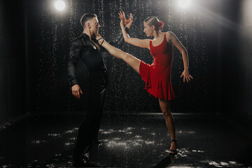 A couple of dancers on a black background in a studio in the aqua zone