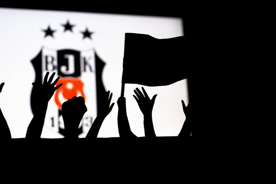 Winning or championship of Beşiktas football club, celebrating concept, soccer team fans silhouette with flag