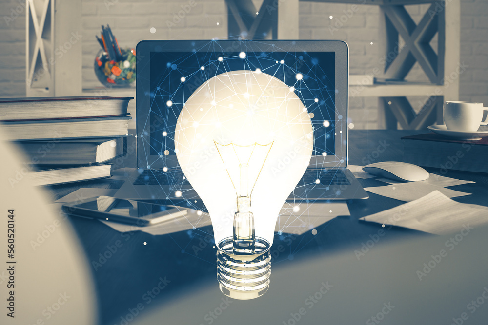 Poster Computer on desktop in office with bulb icon hologram. Multi exposure. Concept of idea.