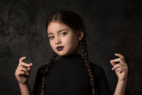 A girl with braids in a gothic style